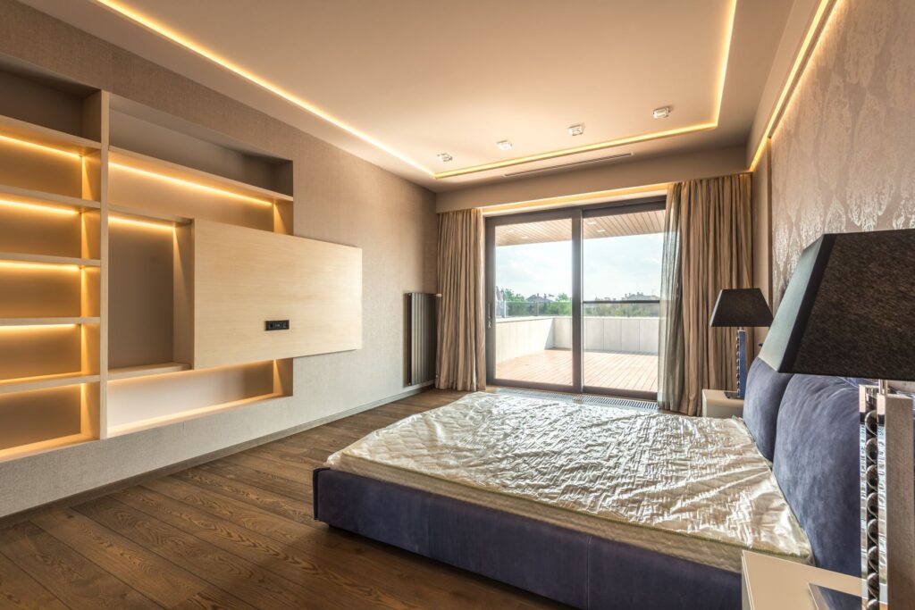 Bedroom with warm bed-head and cove lighting