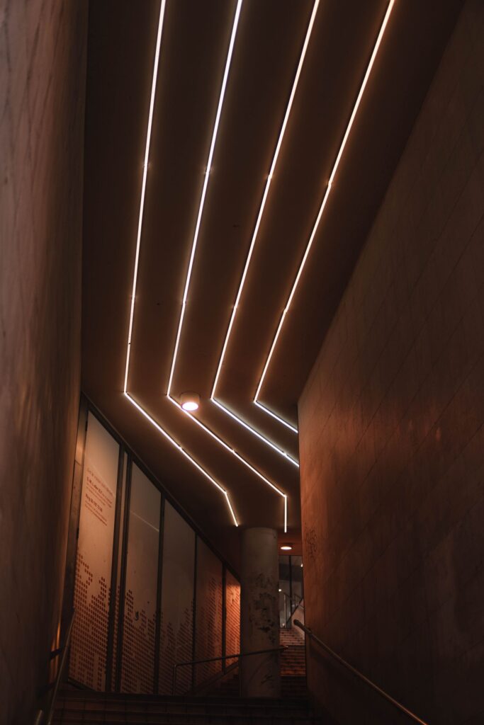 Linear aluminium profile lighting on a wall and ceiling