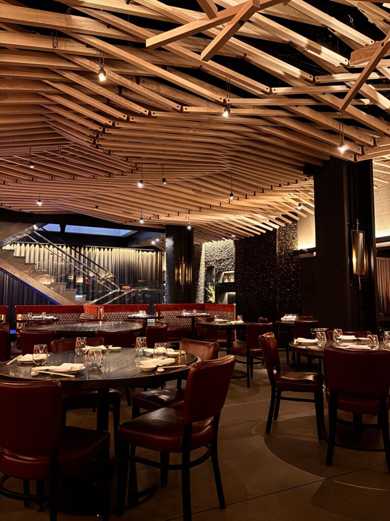 Restaurant with warm ambient ceiling lighting